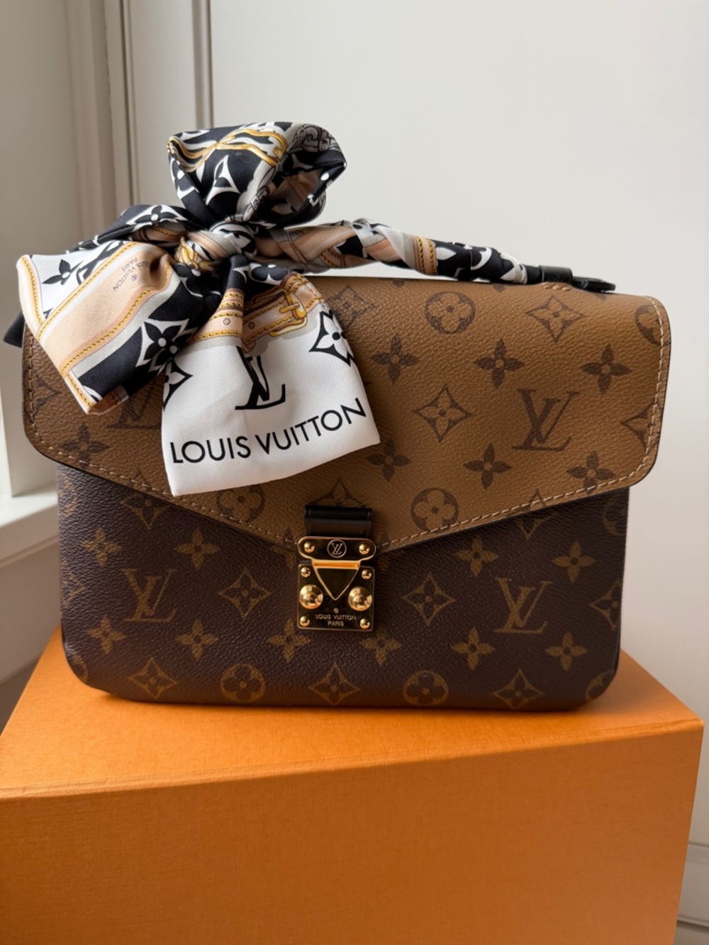 Louis Vuitton Pochette Métis Monogram Reverse Canvas Handbag with LV Twilly